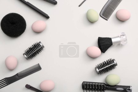 Photo for Easter eggs and hairdressing accessories on white background - Royalty Free Image