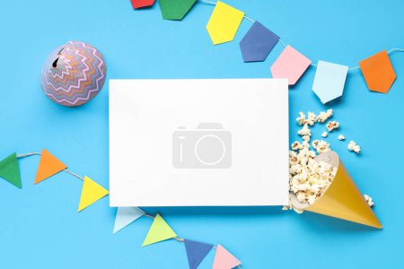 Photo for Composition with blank card, popcorn and decor for Festa Junina celebration on color background - Royalty Free Image