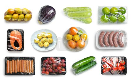 Foto de Collage de alimentos frescos en plástico sobre fondo blanco - Imagen libre de derechos