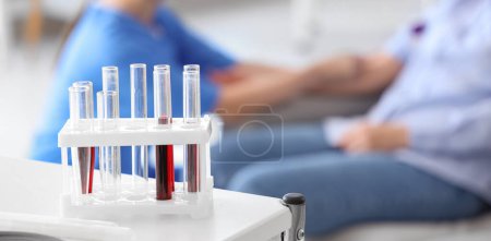 Test tubes with blood on table in clinic