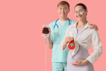Young pregnant woman with paper drop and nurse holding blood pack for transfusion on pink background
