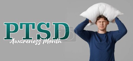 Stressed young man with pillow on grey background. Post-Traumatic Stress Disorder Awareness Month