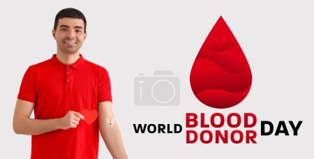 Banner for World Blood Donor Day with young male donor
