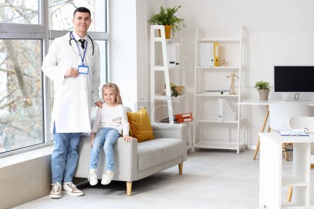 Male pediatrician with blank name tag and little girl at home