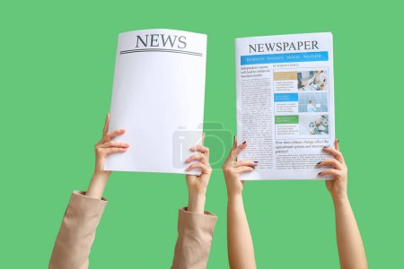 Female hands holding newspaper and paper sheet with word news on green background