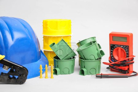 Photo for Different electrician's supplies on light background - Royalty Free Image