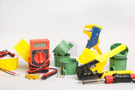 Photo for Different electrician's tools on light background - Royalty Free Image