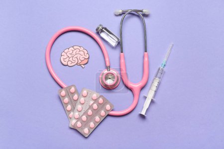 Paper brain with stethoscope, pills and syringe on lilac background. Multiple Sclerosis Awareness Month