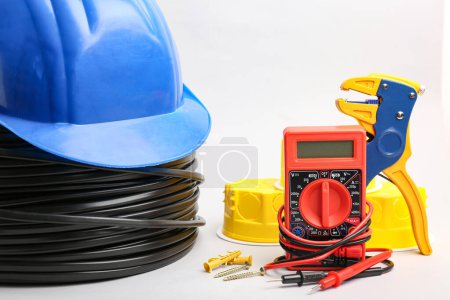 Photo for Different electrician's supplies on light background - Royalty Free Image