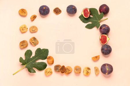 Frame made of sweet dried figs and fresh fruits on orange background