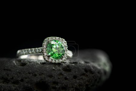 Photo for Engagement ring with green precious gemstone - Royalty Free Image