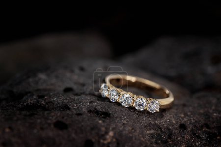 Photo for Five stones diamond ring on black stone - Royalty Free Image