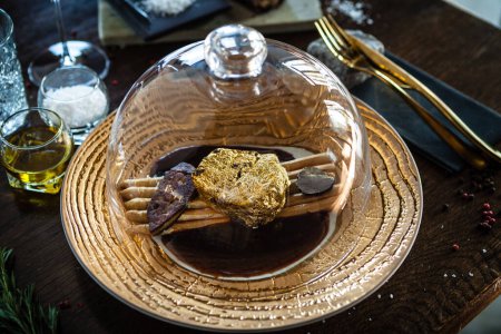 Photo for Black Angus 24 carat gold steak. Beef tenderloin, foie gras, fresh black truffle, white asparagus, port wine sauce. Delicious food closeup served for lunch in modern gourmet cuisine restaurant. - Royalty Free Image