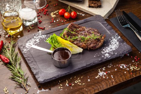 Photo for Black Angus Entrecote steak. Marbled steak from Uruguay. Delicious healthy traditional food closeup served for lunch in modern gourmet cuisine restaurant. - Royalty Free Image