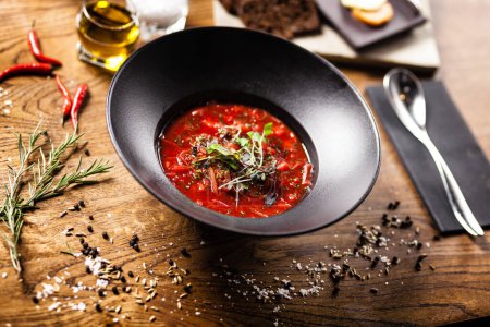 Photo for Beetroot soup Borscht with meat and sourcream in a bowl. Delicious healthy Russian traditional food closeup served for lunch on a table in modern gourmet cuisine restaurant. - Royalty Free Image