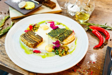 Photo for Pike-perch fillet. Potato gratin, warm yellow beet-turkey bean salad, parmesan dressing. Delicious seafood fish closeup served on a table for lunch in modern cuisine gourmet restaurant. - Royalty Free Image