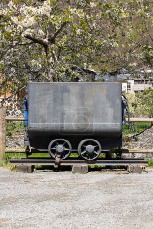 Mine trolley cart wagon on tracks transportation for coal mining in Asturias province of Spain, Tormaleo on a sunny bright spring day.