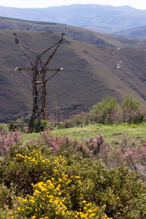 Photo for Abandoned metal tower structure in mountain landscape of Asturias Spain on a bright sunny day - Royalty Free Image