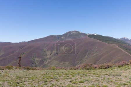 Photo for Steel metal tower structure abandoned in the rocky mountains of Asturias Spain on a bright sunny spring day. - Royalty Free Image