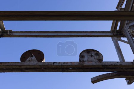 Photo for Metal wheel on steel structure rusted and abandoned. - Royalty Free Image