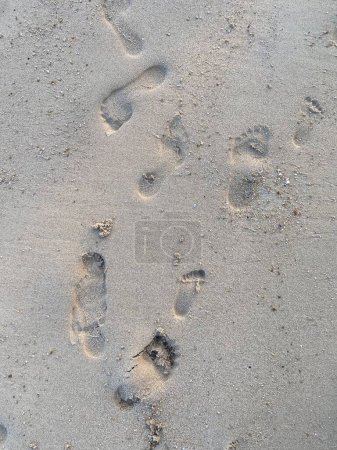Photo for Footprints in the sand on the beach, closeup of photo - Royalty Free Image