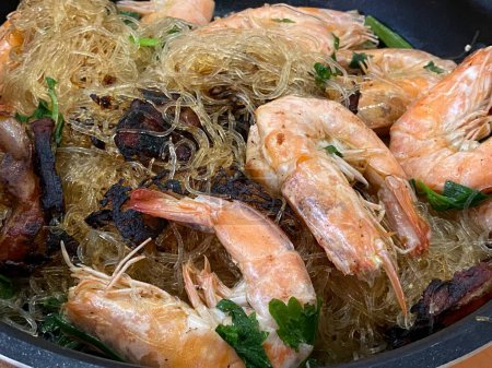 Photo for Shrimps with vermicelli and vegetables in a pan - Royalty Free Image