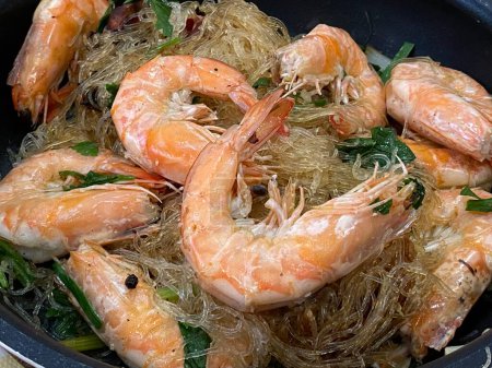 Photo for Shrimps with vermicelli and vegetables in a pan - Royalty Free Image
