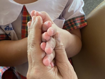 Photo for Close-up of a little girl's hand holding her mother's hand - Royalty Free Image