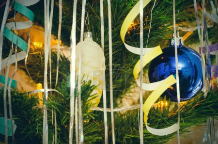Photo for Christmas tree ball with garland lights closeup - Royalty Free Image