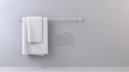 Foto de Toallas blancas simples en toallero sobre fondo brillante - plantilla gráfica - Imagen libre de derechos