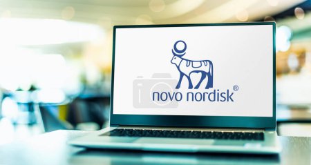 Photo for POZNAN, POL - OCT 28, 2022: Laptop computer displaying logo of Novo Nordisk, a multinational pharmaceutical company headquartered in Bagsvard, Denmark - Royalty Free Image