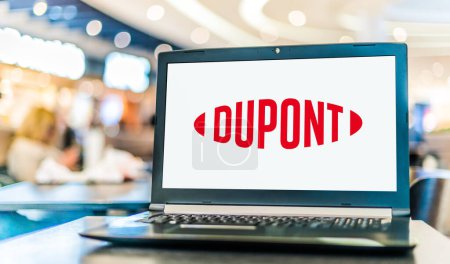 Photo for POZNAN, POL - DEC 28, 2022: Laptop computer displaying logo of DuPont, a chemical company based in Wilmington, Delaware, USA - Royalty Free Image