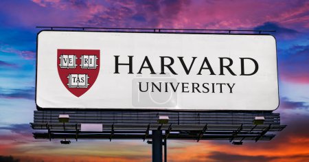 Photo for POZNAN, POL - MAR 7, 2023: Advertisement billboard displaying logo of Harvard University, a private Ivy League research university in Cambridge, Massachusetts - Royalty Free Image