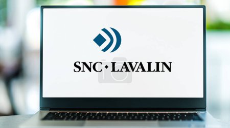 Photo for POZNAN, POL - MAR 8, 2023: Laptop computer displaying logo of SNC-Lavalin Group, a company that provides engineering, procurement, and construction (EPC) services to various industries - Royalty Free Image