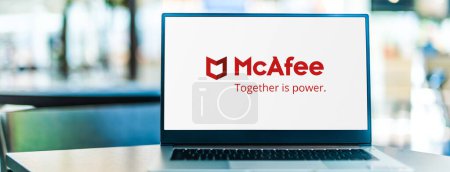 Photo for POZNAN, POL - SEP 23, 2020: Laptop computer displaying logo of McAfee, a global computer security software company headquartered in Santa Clara, California, USA - Royalty Free Image