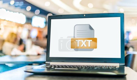 Photo for Laptop computer displaying the icon of TXT file - Royalty Free Image