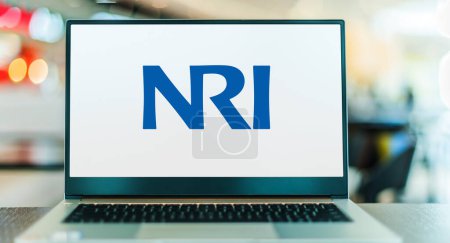 Photo for POZNAN, POL - FEB 21, 2023: Laptop computer displaying logo of Nomura Research Institute, the largest economic research and consulting firm in Japan, and a member of the Nomura Group. - Royalty Free Image