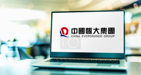 Photo for POZNAN, POL - FEB 8, 2023: Laptop computer displaying logo of The China Evergrande Group, the second largest property developer in China by sales - Royalty Free Image