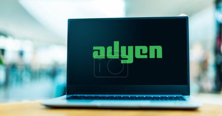 Photo for POZNAN, POL - OCT 13, 2021: Laptop computer displaying logo of Adyen, a Dutch payment company that allows businesses to accept e-commerce, mobile, and point-of-sale payments - Royalty Free Image