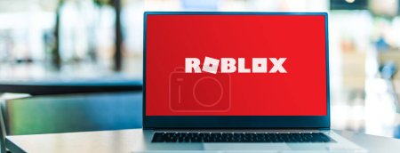 Photo for POZNAN, POL - JAN 6, 2021: Laptop computer displaying logo of Roblox, an online game platform and game creation system that allows users to program games and play games created by other users - Royalty Free Image