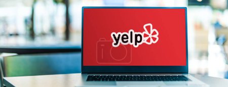 Photo for POZNAN, POL - JAN 6, 2021: Laptop computer displaying logo of Yelp, an American public company headquartered in San Francisco, California - Royalty Free Image