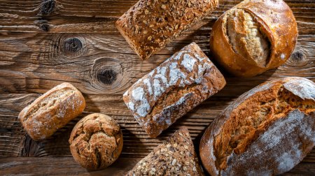 Photo for Assorted bakery products including loaves of bread and rolls - Royalty Free Image