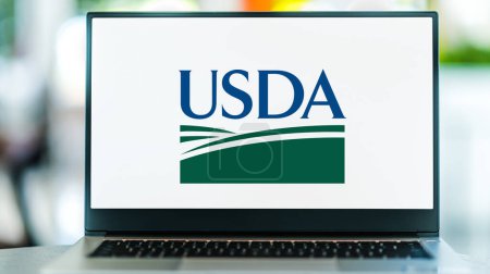 Photo for POZNAN, POL - MAY 1, 2021: Laptop computer displaying logo of USDA, the federal executive department responsible for developing and executing federal laws related to farming, forestry and food - Royalty Free Image