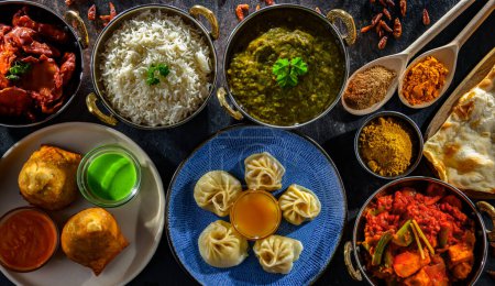 Photo for Composition with indian dishes: samosa, pakora, palak paneer, jalfrezi, thukpa and naan bread - Royalty Free Image