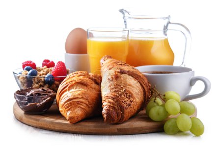 Photo for Breakfast served with coffee, orange juice, egg, cereals and croissants isolated on white - Royalty Free Image