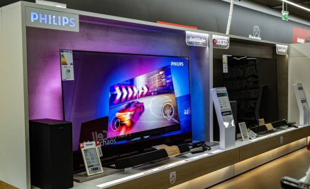 Photo for POZNAN, POL - DEC 8, 2023: Modern flat-screen TV sets put up for sale in an electronics store - Royalty Free Image