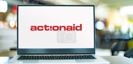 Photo for POZNAN, POL - DEC 5, 2023: Laptop computer displaying logo of ActionAid, an international non-governmental organization that works against poverty and injustice worldwide - Royalty Free Image