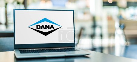 Photo for POZNAN, POL - JAN 6, 2024: Laptop computer displaying logo of Dana, a supplier of axles, driveshafts, transmissions, and electrodynamic, thermal, sealing, and digital equipment for vehicles - Royalty Free Image