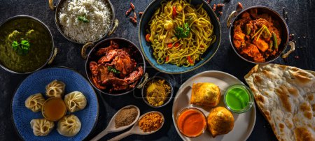 Photo for Composition with indian dishes: samosa, pakora, palak paneer, jalfrezi, thukpa and naan bread - Royalty Free Image