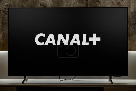 Photo for POZNAN, POL - DEC 19, 2023: Flat-screen TV set displaying logo of Canal+ (Canal Plus), a French premium television channel - Royalty Free Image